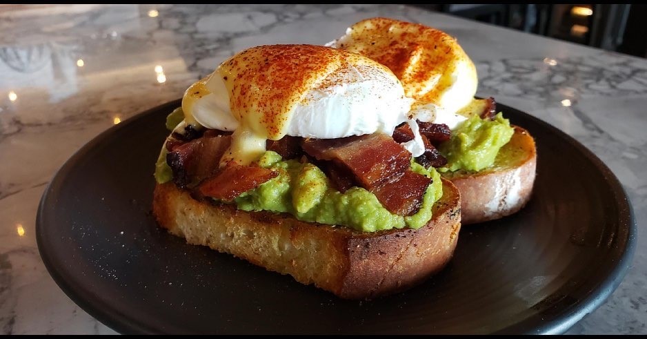 avocado toast with poached eggs and bacon