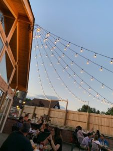 outdoor dining under cafe lighting