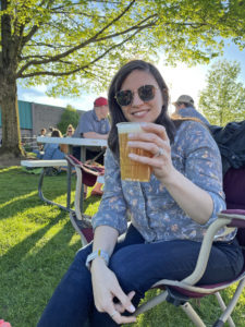 woman holding a pint of beer