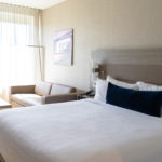 hotel room with bed and white linen