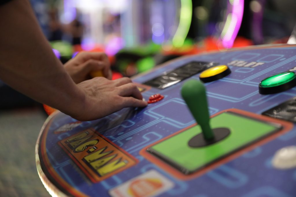 close up playing pac man arcade game