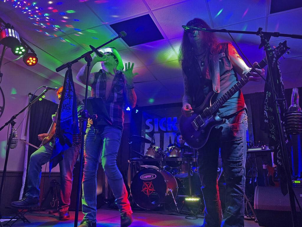 singer and guitarist performing live music